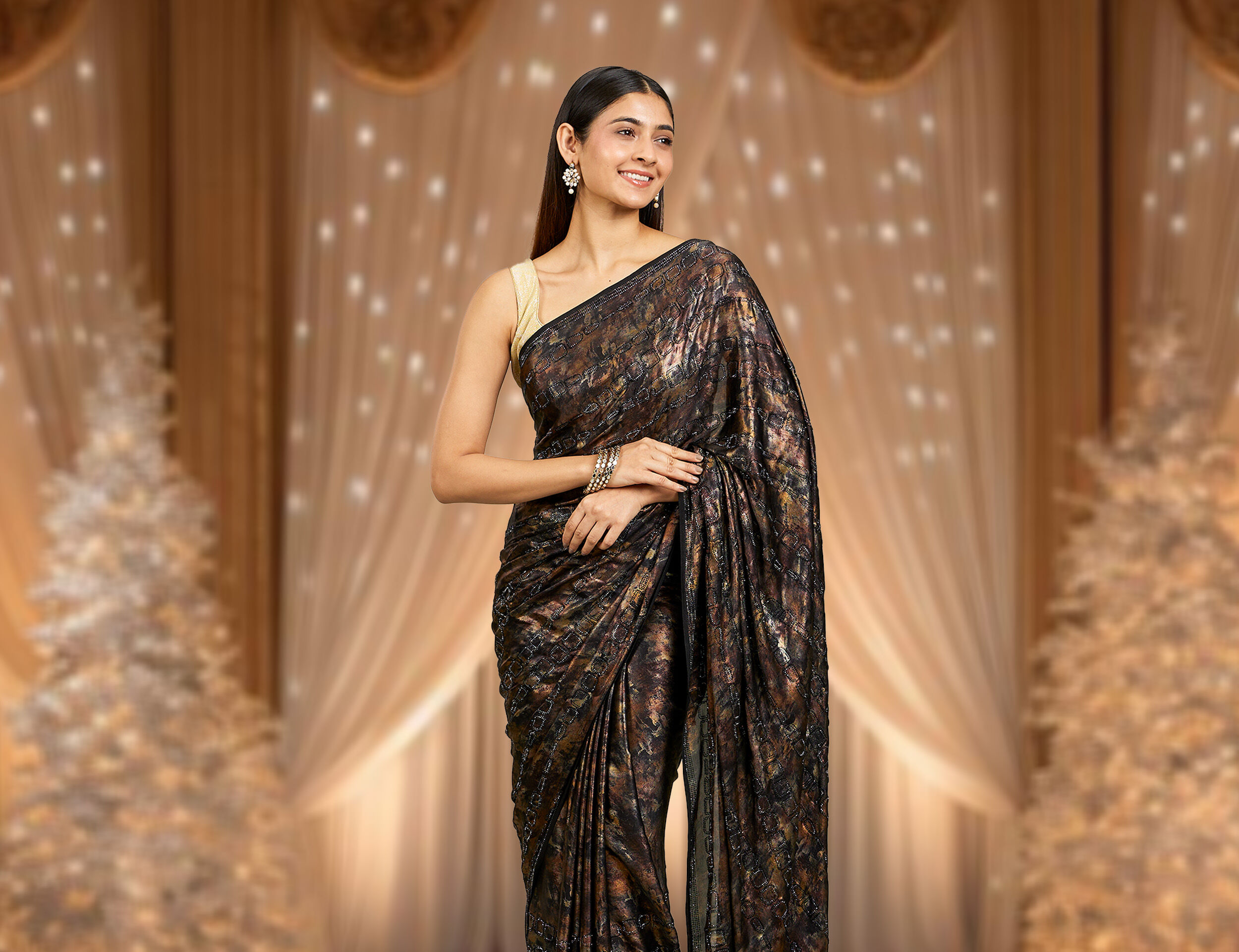 A woman flaunting her beautiful black saree for evening glam